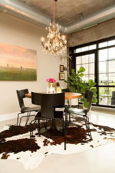 this cow hide rug brings the look of this dining room together. Cow Hide Rug Dining Table, Cowhide Rug Dining, Cowhide Rug Dining Room, Pink Decor Ideas, Wall Dining Room, Domino Magazine, Dining Room Wall Decor, Hide Rug, Rug Dining Room