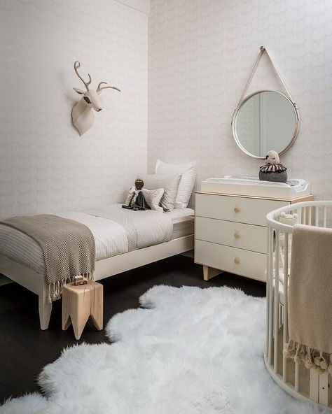 Nursery that doubles as bedroom... May not be possible with twins...  Fun boy's nursery features an ivory oval crib dressed in neutral crib bedding atop a white sheepskin pelt. Transitional Nursery, Shared Nursery, Neutral Crib, Dreamy Nursery, Neutral Room, Shared Room, Kids Interior, Baby's Room, Nursery Inspiration