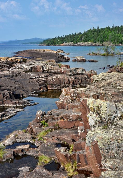 The rocky shoreline along Grand Marais with the Sawtooth Mountains in the background/ North Shore, Minnesota. North Shore Minnesota, Rocky Shoreline, Sawtooth Mountains, Grand Marais, Rocky Shore, Gods Creation, Summer Bucket Lists, Lake Superior, Warrior Cats