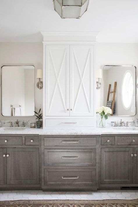 Kate Marker Interiors - Emily Kennedy Styling & Photography - Large marble hex floor tiles lead complement a brown stained oak dual bath vanity accented with chrome hardware and a white and gray honed countertop. White Linen Cabinet, Polished Nickel Faucet, Kate Marker Interiors, Gray And White Bathroom, Brass Cabinet Pulls, Bad Inspiration, Transitional Bathroom, Master Bath Remodel, Bathroom Goals