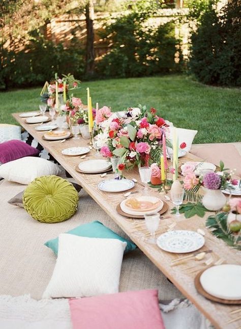 For this bohemian backyard bash, designer Jessie Capstick layered rugs and pillows to create comfortable floor seating, allowing for a more intimate and relaxed dinner.Via Inspired By This Boho Style Party, Boho Chic Party, Bohemian Backyard, Summer Table Settings, Boho Birthday Party, Party Seating, Deco Champetre, Outdoor Dinner Parties, Party Tablescapes