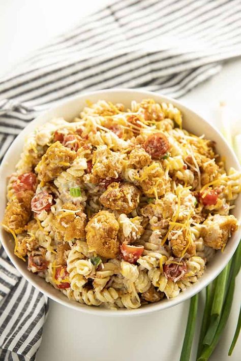 Popcorn Chicken Bacon Ranch Pasta Salad - This mouthwatering and easy to make pasta salad recipe is a summertime potluck favorite!  Full of crispy chicken, bacon, cheddar cheese, noodles, and creamy ranch dressing! Chicken Bacon Ranch Pasta Salad, Cajun Chicken Salad, The Salty Marshmallow, Salty Marshmallow, Bacon Ranch Pasta Salad, Chicken Ranch Pasta, Chicken Bacon Ranch Pasta, Cold Pasta Salad Recipes, Pasta Salad Dressing