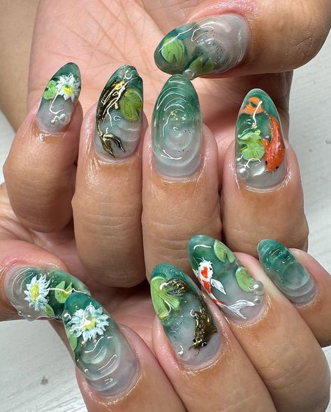 ✨ Dive into elegance and artistry with our Koi Pond Press-On Nail Set, a stunning masterpiece inspired by the serenity of nature. Featuring intricate hand-painted koi fish, and shimmering water effects, this set brings the beauty of a tranquil pond to your fingertips. Perfect for those who appreciate unique, artistic designs and crave a touch of natural charm. 🌸 Key Features: 💎 Hand-Painted Artwork: Each nail is carefully hand-painted by skilled artisans, showcasing breathtaking details of koi fish and rippling water. Every set is a one-of-a-kind masterpiece! 🐟 Nature-Inspired Design: Featuring vibrant koi fish and delicate floral details, these nails capture the essence of a peaceful koi pond. A perfect blend of elegance and tranquility. 💅 3D Elements: Enjoy the added dimension with 3 Pond Nail Art, Coy Fish Nails, Koi Pond Nails, Complex Nail Art, Water Colour Nails, Goldfish Nails, Japanese Inspired Nails, Pond Nails, Koi Nails