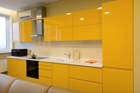 Interesting ideas and decorating tips to create a springy & colorful atmosphere in the modern kitchen by adding colors to the walls,  furniture or accessories.@cubedecors www.cubedecors.com #design #decoration #decors #interiordesign #interiordecors #idea #cubedecors #colorful Modern Yellow Kitchen Cabinets, Modern Yellow Kitchen, Yellow Kitchen Cabinets, Yellow Cabinets, Modular Kitchen Cabinets, Kitchen Modular, Kitchen Cupboard Designs, Small Kitchen Storage, Kitchen Interior Design Decor