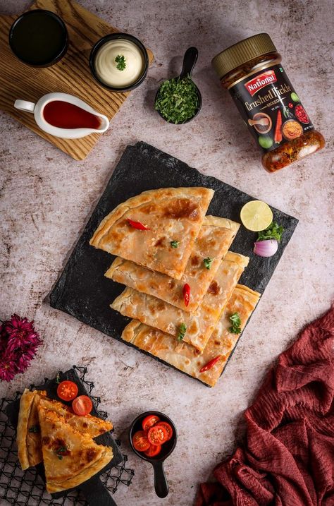 Everyone loves a delicious paratha with their chai during sehri, but have you tried our version? A true indulgence of a spicy Achaari filling with vegetables and cheese takes this stuffed paratha to another level. Watch Full Recipe Video: https://madeeasy.com.pk/recipes/achaari-pizza-paratha #MadeEasy #NationalFoods #AchariPizzaParatha #FusionRecipe #Ramadan Paratha Plating Ideas, Paratha Photography, Alu Paratha, Pizza Paratha, Cheese Paratha, Stuffed Paratha, Ultimate Sandwich, Food Shoot, Paratha Recipes