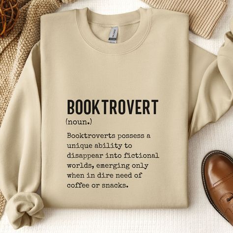 Indulge your bookish soul with this charming Booktrovert sweatshirt, crafted to keep you cozy and warm on cooler days. Embrace your love for books and showcase your unique style with this minimalist yet captivating design, perfect for any devoted book lover. Our unisex heavy blend crewneck sweatshirt offers unparalleled comfort, making it an ideal choice for all book enthusiasts. Crafted from a delightful blend of polyester and cotton, these garments guarantee a soft and snug fit, ensuring you f Book Lover Outfits, Book Worm Outfit Aesthetic, Bookish Aesthetic Outfit, Book Hoodies, Bookworm Gift Ideas, Bookish Sweatshirts, Cozy Gifts, Book Lover Gift Ideas, Clothes To Buy