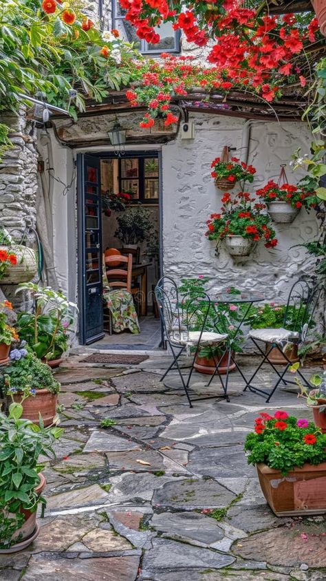 A traditional Greek house featuring a vibrant bougainvillea tree in white stone and terracotta pots on the terrace royalty free stock photos Greek Terrace, Traditional Greek House, Greek Stone House, Stone House Decor, Greek Village House Interior, Istrian Stone House, Greek Village Aesthetic, Bougainvillea Tree, Ancient Greek Village