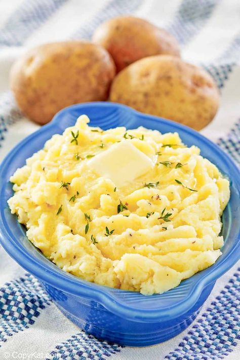 Yukon Gold Mashed Potatoes are a buttery, creamy, and delicious side dish. Get the easy recipe and find out how to make the best mashed potatoes with yellow potatoes. Heating milk with herbs and onion give these mashed Yukon gold potatoes extraordinary flavor. A must-make recipe perfect for a special dinner and Thanksgiving, Christmas, or Easter holidays. #mashedpotatoes #mashedpotatoesrecipe #potatosidedish #thanksgivingsidedishes Gold Mashed Potatoes, Gold Potato Recipes, Yukon Gold Mashed Potatoes, The Best Mashed Potatoes, Garlic Food, Buttery Mashed Potatoes, Yukon Potatoes, Best Mashed Potatoes, Mashed Potatoes Recipe