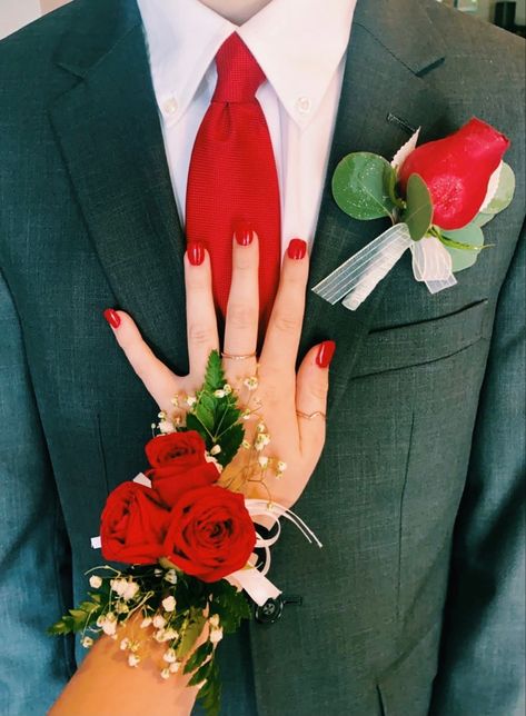 Hoco Corsage For Black Dress, Black Prom Dress Red Accessories, Prom Coursage Ideas Black And Red, Black And Red Prom Flowers, Black Prom Dresses With Red Heels, Black And Red Prom Aesthetic, Red Prom Tux Guys, Red Prom Dress With Black Heels, Tux With Red Dress Prom