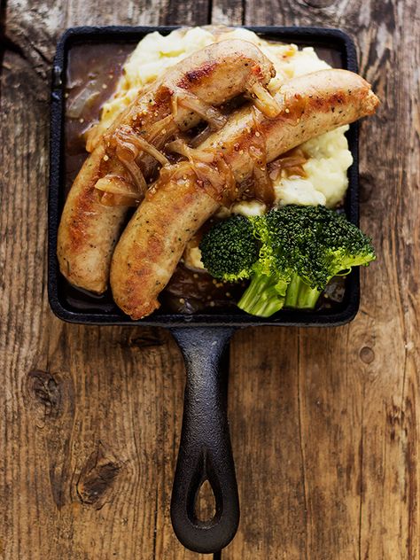 Bangers and Mash: Sausage and Sour Cream Mashed Potatoes with an Onion and Mustard Gravy Cream Mashed Potatoes, Sour Cream Mashed Potatoes, Hp Sauce, Sausage Dishes, Bangers And Mash, Pub Food, Main Course Recipes, English Food, British Food