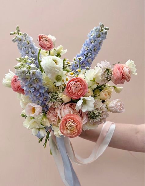 Blue Yellow Pink Wedding Bouquet, Light Pink And Blue Flower Bouquet, Blue White And Peach Bridal Bouquet, Pink Peach Blue Wedding Flowers, Pastel Pink And Blue Bouquet, Delphinium Bouquet, Blue Orange Weddings, Peach Ranunculus, Blue Delphinium