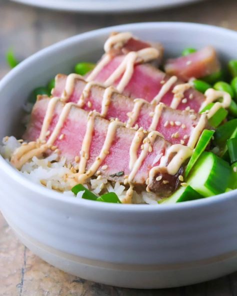 Seared Tuna Poke Bowls: soy sauce-marinated ahi tuna steaks , cilantro rice, fresh veggies and a spicy mayo sauce, this is a tasty and filling meal! . Recipe via @sanna.womanscribbles . #ahipoke #pokebowls #tunapokebowl #whatsforlunch #whatsfordinner #bonappetit #easymeals #foodblogfeed #foodphotography #yycfoodphotographer . https://www.womanscribbles.net/seared-tuna-poke-bowls/ Cooking Ahi Tuna, Ube Flan, Ahi Tuna Steaks, Spicy Mayo Sauce, Ahi Tuna Poke, Lemon Quinoa, Custard Buns, Tuna Poke Bowl, Mini Bun