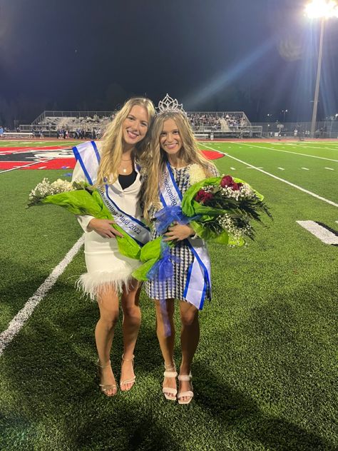 Homecoming queen and maid in homecoming suits holding bouquets at homecoming football game Homecoming Court Aesthetic, Homecoming Court Suits, Homecoming Queen Aesthetic, Homecoming Group Pictures, Hoco Queen, Homecoming Aesthetic, Cheer Vibes, 2023 Mindset, Teenage Lifestyle