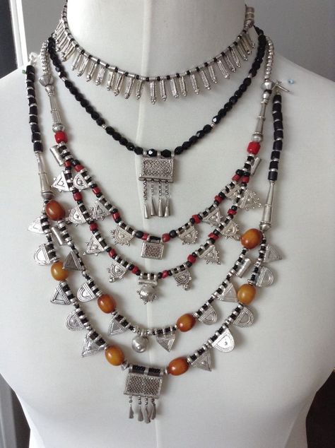 Picture credit – Ingrid Langerak Posted by – Ingrid Langerak A collection of East African necklaces. The top is an Eritrean fertility necklace, with anklet symbols. There are two necklaces with Ethiopian Wollo prayer boxes, and two necklaces with Wollo and Gondar good silver telsums, with old resin beads. One of these also has re-constituted red coral and black glass beads. Ethiopian Jewelry Traditional, Ethiopian Necklace, African Necklaces, Beautiful Culture, African Inspired Jewelry, Habesha Dress, Ethiopian Jewelry, Ethiopian Dress, Habesha Kemis