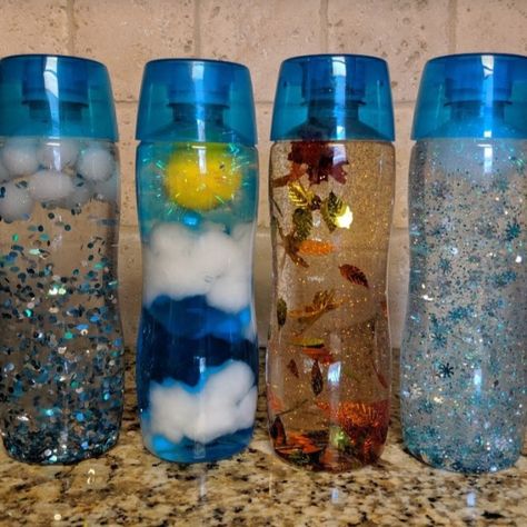 Seasons and Weather Sensory Bottles – Tea in the Wild Weather Sensory Bottles, Weather Sensory, Sensory Bottles Preschool, Calm Down Jar, Seasons And Weather, Calm Down Bottle, Preschool Weather, Discovery Bottles, Sensory Bottle