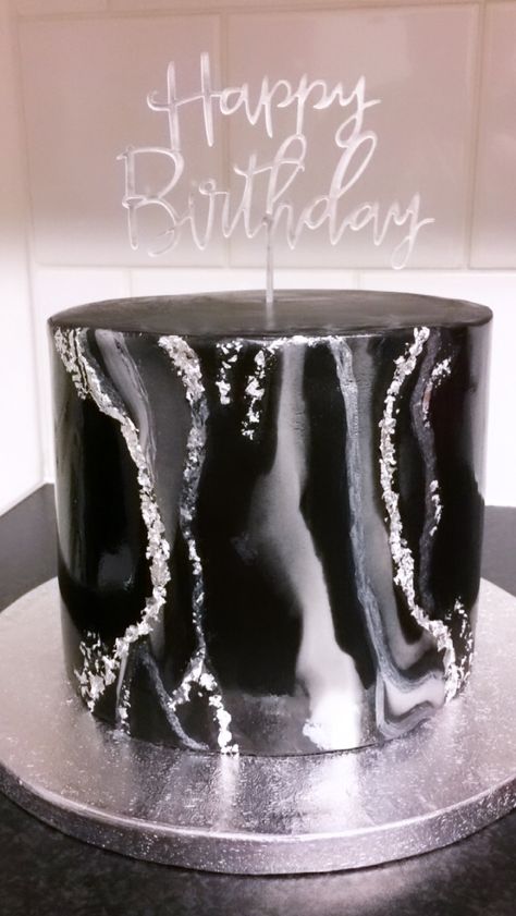 Black and white marble fondant cake with specs of edible silver leaf. Simple but elegant #blackcake #blackandsilvercake #marblefondant @calizaskitchencakes Black White And Silver Birthday Theme, Black Birthday Cake Ideas, Black And Silver Theme Cake, Black And Silver Cake Birthday For Women, Black Marble Cake, Black And Silver Cake Ideas, Black White And Silver Cake Ideas, Black And White Cake Aesthetic, Marble Cakes