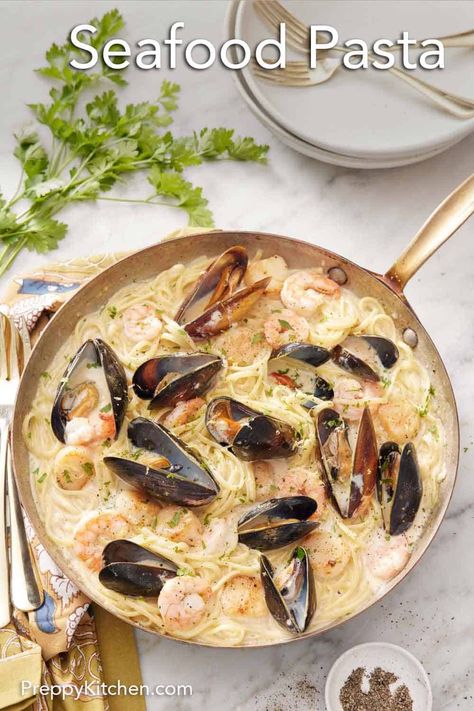 Ready in under 30 minutes, this Seafood Pasta is simple to make and packed with indulgent flavors. Delicious shrimp, scallops, mussels, and perfectly al dente linguine are bathed in a rich, creamy sauce and topped with shredded parmesan cheese. It is an easy recipe that will satisfy your seafood cravings and make any occasion feel special! Mussels Recipe Pasta, Pasta With Mussels, Seafood Cravings, Creamy Seafood Pasta, Mussels Pasta, Seafood Soups, Seafood Sandwiches, Scallop Pasta, Creamy Seafood