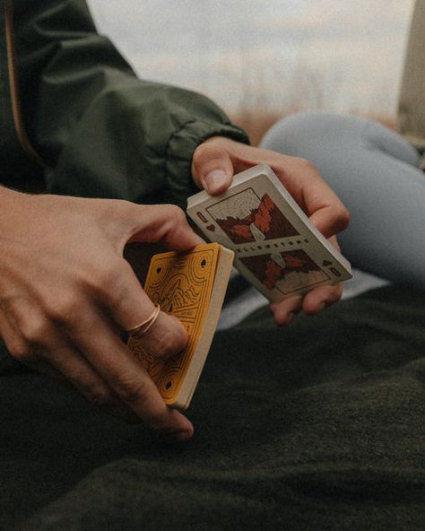 Go all in on this deck of cards featuring original illustrations of America’s National Parks. Playing cards were in use well before our first park was established in 1872, but over the past 150 years America has set aside its most beautiful places to become cherished public lands. These Playing Cards are a monument to America’s past - one that any camper (or magician) would be glad to have in their back pocket. When we say you’ll love this deck, we’re not bluffing. Packaged and sealed in a speci Aces And Eights, Landmark Poster, Funny Statements, Scratch Off Cards, Card Photography, Just A Game, Playing Card, Dry Hands, Cross Stitch Kits