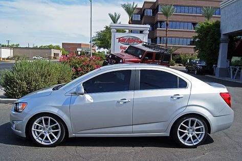 Pictures and description of a 2014 Chevrolet Sonic LT Silver. 225/40R18 Toyo Extensa | 18x8 Niche Targa | Eibach Leveling Kit (1.2” Front/ 1.4” Rear) Spark Gt, Chevrolet Sail, Chevy Vehicles, Chevy Sonic, Chevrolet Sonic, Rims For Cars, Compact Cars, Chevrolet Cruze, Mountain Bike