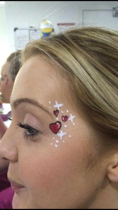 Valentines face painting- sparkly hearts. Simple Face Paint Designs, Easy Face Painting Designs, Painting Valentines, Eye Face Painting, Festival Face Paint, Cheek Art, Festival Face, Face Painting Easy, Kids Face Paint