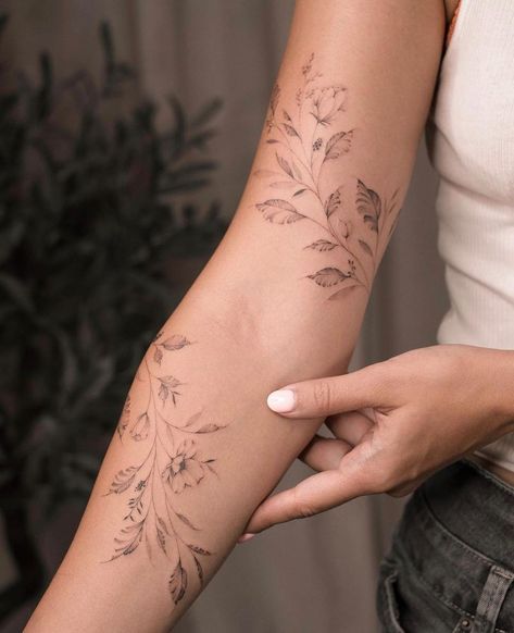 Tattoos✓ • Instagram Dainty Arm Sleeve Tattoos For Women, Feminine Fine Line Tattoo Sleeve, Lily Of The Valley Tattoo Arm Wrap, Lily Of The Valley Tattoo Arm, Julia Havens Tattoo, Body Wrap Tattoo, Wrist To Hand Tattoo, Flower Leaves Tattoo, Wrap Around Arm Tattoo For Women