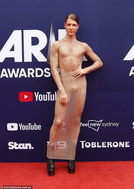 ARIA Awards 2023: Christian Wilkins wears a VERY revealing dress as he leads the stars on red carpet - but that is not the only thing people are talking about Check more at https://maholicious.com/aria-awards-2023-christian-wilkins-wears-a-very-revealing-dress-as-he-leads-the-stars-on-red-carpet-but-that-is-not-the-only-thing-people-are-talking-about/ Sparkly Red Dress, Christian Wilkins, Black Chunky Boots, Black Slim Pants, J Star, Revealing Dress, Awards Night, Nude Dress, Looking Dapper