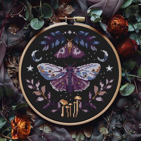 🖤 The design by me, the license is not for sale, but you can sell finished cross stitch 🖤 Gothic moth cross stitch pattern PDF Fabric: 14-count Floss: DMC Dimensions: 111 stitches wide x 109 stitches tall, 7.9 x 7.8 inches (20.1 x 19.8 cm) 9" hoop Included in this easy to read PDF pattern: * printable version of final stitched product  * colour symbol chart * color floss legend with DMC This PDF counted cross stitch pattern available for instant download. No fabric, floss or materials are incl Cross Stitch Moth Pattern, Cross Stitch Patterns Witchy, Wicca Cross Stitch, Witchy Cross Stitch Patterns Free, Cross Stitch Charts Free Pattern, Cross Stitch Designs Pattern, Witchy Cross Stitch Patterns, Dark Cross Stitch, Witchy Cross Stitch