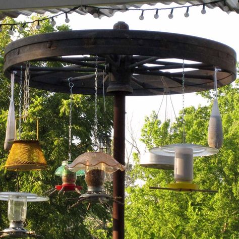 41 Really Cute Bird Feeder Ideas | Family Handyman Covered Bird Feeder, Bird Feeder Station Ideas, Winter Bird Feeders, Bird Feeder Station, Large Bird Feeders, Bird Feeder Stands, Backyard Birds Sanctuary, Backyard Birds Feeders, Pine Cone Bird Feeder