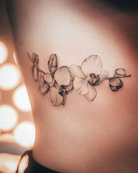 Top 100 Best Orchid Tattoos For Women - Flower Design Ideas Lotus And Orchid Tattoo, Orchid Tattoo Rib Cage, Orchid Arm Tattoos For Women, Orchid Branch Tattoo, Orchid Tattoos For Women, Orchid Back Tattoo, Fine Line Orchid Tattoo, Watercolor Orchid Tattoo, Orchid Tattoo Design