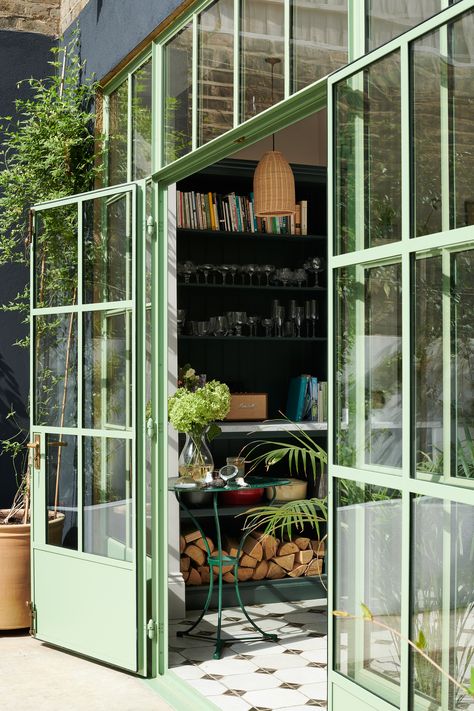 How dreamy are this pistachio-coloured Crittall doors? They are part of a wonderful home renovation in Chiswick which was designed by interior design company, Clarence & Graves. Handcrafted Shaker cabinets painted in a bespoke, deliciously dark green shade, topped with Statuarietto marble and finished with some of our handmade brass knobs and handles. Click the link to get the full kitchen tour. #deVOLKitchens #Crittall #GreenInteriors #KitchenDoors Green Kitchen Designs, Crittal Windows, Devol Kitchens, Green Windows, Basement Kitchen, Green Door, Shaker Kitchen, Kitchen Extension, Green Kitchen