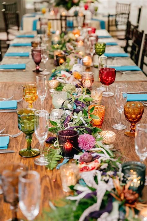 39 Prettiest Whimsical Wedding Decoration Ideas Ever Eclectic Floral Wedding, Wedding Colorful Glassware, Jewel Tone Glassware Wedding, Indoor Garden Party Wedding Reception, Colourful Whimsical Wedding, Whimsical Botanical Wedding, Coloured Glassware Wedding, Colorful Whimsical Garden Wedding, Bright Boho Wedding Decor