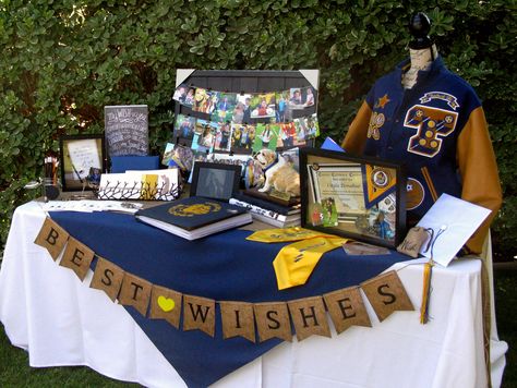 Wishing Table ... photos, awards, high school memorabilia, digital frame, sports scrap book, and "My Wish" cards. Graduation Party Picture Display, Senior Table, Graduation Display, Senior Board, Graduation Party Pictures, Southern Bbq, High School Graduation Party Decorations, Graduation Party Table, Graduation Memories