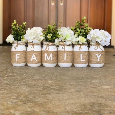 This Is A Custom Designed & Hand-Painted Set 6 Pint Size Mason Jars Wrapped In Burlap To Spell Out Family. Each Jar Is Hand Painted, Lightly Distressed And Sealed. Also Each Jar Is Then Wrapped With A Hand Painted Letter On The Burlap. We Add Jute Rope On The Top To Finish This Set Off Perfectly. Flowers Are Not Included Mason Jars Decor, Decor With Flowers, Baptism Decorations Girl, Jars Decor, Theme Bapteme, Burlap Mason Jars, Chalk Paint Mason Jars, Glitter Mason Jars, Deco Champetre