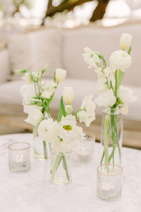 https://freshweddingsandevents.com/ Instagram: @FreshWeddings_CHS White And Green Bud Vases, Bud Base Center Piece Round Table, White Bud Vase Centerpiece, Diy Bud Vases Wedding, Bud Vase White Flowers, Long Table Bud Vases, White Flowers In Bud Vases, Bud Vases White Flowers, White Floral Bud Vases