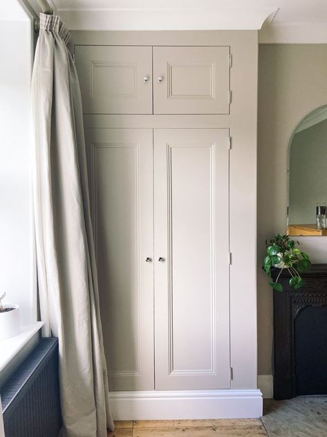 We had a large alcove in the bedroom at No. 8, which was crying out to be used for some built in storage. My husband Will built this Victorian-style wardrobe by framing out the alcove, and building the shell from MDF. We painted it in Farrow & Ball Elephants Breath Estate Eggshell, and i'm sure you'll agree it looks beautiful! It was so useful for storage, and completely transformed the room. Coloured Built In Wardrobe, Built In Storage Cupboard, Built In Wardrobe Ideas Victorian House, Alcove Cupboards Bedroom, Wardrobes In Alcoves, Wardrobe Alcove, Built In Wardrobe Ideas Alcove, Office Bedroom Combo, Floor To Ceiling Wardrobes