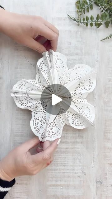 gina luker | arts + crafts on Instagram: "DIY doily snowflakes - aren’t these so beautiful? A couple of things to note: you don’t need 2 sizes of staplers - just use a small one. The big one is too big to do the center connecting staple. If you don’t have a stapler you could use the glue stick (gently) for the entire thing. I used 5 doilies for a 12 inch version - smaller ones are doable but I’d suggest using glue to connect them all. Also… I’m pretty sure it looks more like a flower than a snowflake 🤣🤣🤣" Doily Snowflakes, Snowflake Bouquet, Doilies Diy, Paper Doily Crafts, Diy Doily, Paper Lace Doilies, Doily Art, Doilies Crafts, Snowflake Craft