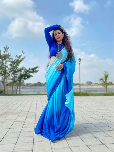 Ombre shaded satin saree in gradiant blue shades. We customise shaded satin sarees to your choice of shades. #TheMuseGirlie #saree #sareeblouse #sareeblousedesigns #satinsaree #sareestyles #satin #satinsilk #satinpajamas #sareedesigns #cocktailsaree #farewellsaree #bridesmaidsaree #bridesmaids #bridesmaiddresses2019 #sari #sariblouse #designersaree #designersareesdelhi #designersareesusa #ombreshadedsaree #shadedsaree Ombre Saree, Satin Sarees, Farewell Sarees, Long Gown Design, Silk Sarees With Price, Bridesmaid Saree, Satin Saree, Fashion Design Dress, Blue Saree