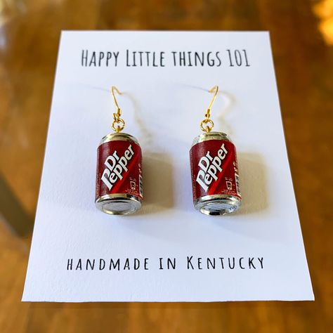 It's a must-have item for a classic soda lover!! It's a fun gift for your friend, loved one or yourself. We use quality 18K gold plated stainless. All the earrings are nickel free & safe for sensitive skin. Have fun!! These famous icon will make everyone smile❤️ Now each item comes in a small individual box. It will be ready as a gift❤️ Thank you for the taking the time out to look at our earrings. Please visit our shop for more original designs: https://www.etsy.com/shop/HappyLittleThings101 ---------------------------------------------------------- **Now we also sell Personalized Gift Mugs❤️ Please click on the link below: https://www.etsy.com/listing/1670692166/thank-you-for-going-the-extra-mile?click_key=04c4a6f46f3a59bf97b7faa6298707eee266184c%3A1670692166&click_sum=76c55f4b&ref=shop_ Fun Jewelry Aesthetic, Unique Earrings Weird, Weird Earrings Aesthetic, Fun Earrings Unique, Silly Earrings, Lesbian Earrings, Weird Earrings, Cool Earrings, Funny Jewelry