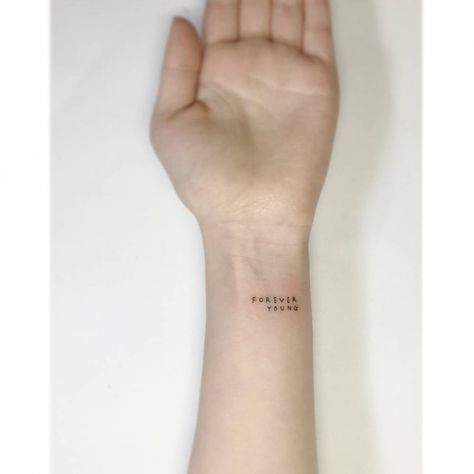 Forever 17 Tattoo, Tattoo Designs For Boys, Forever Evolving Tattoo, Wrist Tattoo Lettering, Young Hearts Run Free Tattoo, Yesterday Today And Forever Tattoo, Young Forever Tattoo, Be Here Now Wrist Tattoo, Stay Alive Tattoo Bts