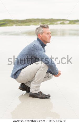 Man Crouching, Pose Reference Photo, Pose Reference, Travel Pillow, Art Reference, Getty Images, Men Sweater, Stock Photos, ? Logo