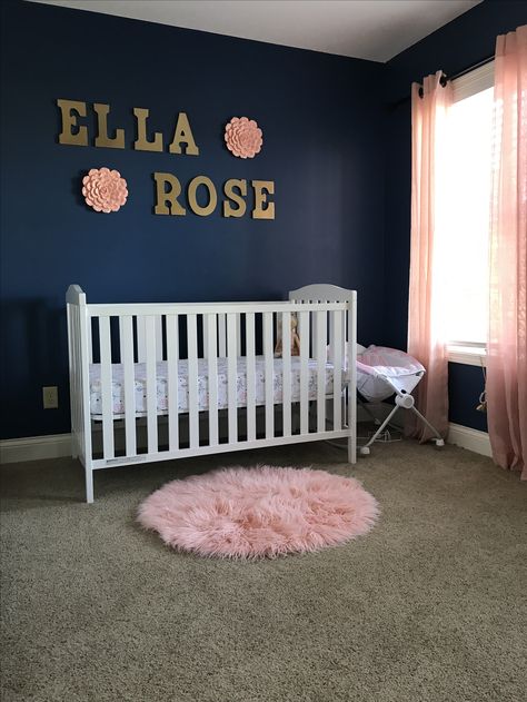 Navy accent Wall Rose Wall Hanging Dark Blue And Pink Nursery, Navy Blue And Gold Nursery, Blue Pink Nursery, Navy Blue Nursery Girl, Navy Wallpaper Accent Wall, Wallpaper Accent Wall Nursery, Navy And Pink Nursery, Navy Girl Nursery, Pink And Navy Nursery