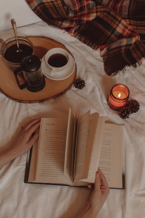 hands flip the pages of a book next to a burning candle and a mug of coffee January Reading, Book And Coffee, Emotional Books, Book Hangover, Gel Manicure At Home, Bookstagram Inspiration, Coffee Wallpaper, Book Wallpaper, Book Release