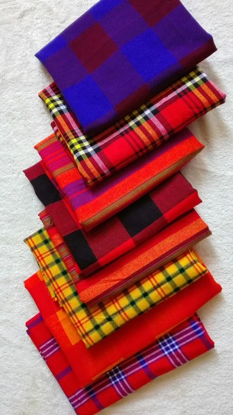 The Shuka Cloth, originating from the Maasai Tribe in Kenya East Africa.   Here at Tuku Fontein we still cherish the original Shuka Maasai Cloth, because it's more than just fabric, it's a nations dignity! It is strong, colorful and very friendly to the skin  #KeDiNonwaneTsaDiTuku Maasai Tribe Clothing, Maasai Dress Designs, African Exhibition, The Rock Outfit, Maasai Dress, African Living Rooms, Kenyan Flag, African Museum, Maasai Shuka