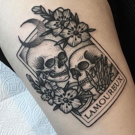 Dot-work style tattoo of two skulls, flowers, and a word ‘La Moureux’ which in French means ‘the lovers’ Skulls Flowers, 16 Tattoo, Tarot Tattoo, Original Tattoos, Geniale Tattoos, Style Tattoo, Card Tattoo, Tattoo Kits, Tattoo Life