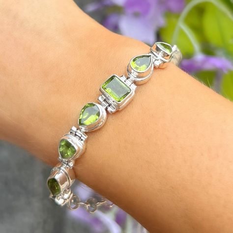 🌟 New Arrivals Alert! 🌟 We’re excited to introduce our new sterling silver green peridot collection, now live on our website! 💚✨ From delicate earrings to statement bracelets, each design showcases the vibrant beauty of peridot, a gemstone treasured for its radiant color and uplifting energy. 𝗪𝗵𝘆 𝗖𝗵𝗼𝗼𝘀𝗲 𝗣𝗲𝗿𝗶𝗱𝗼𝘁? 🌱 Positivity & Renewal: Peridot is believed to bring positivity, peace, and harmony—perfect for embracing new beginnings. 💚 Emotional Balance: This radiant green gem has been use... Elegant Rectangular Peridot Jewelry, Green Peridot Bracelet, Luxury Faceted Peridot Jewelry, Luxury Peridot Multi-stone Jewelry, Statement Bracelets, Green Peridot Multi-stone Jewelry, Green Gem, Emotional Balance, Green Gems