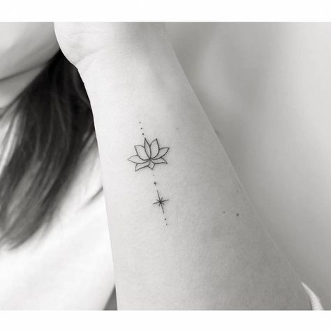 Minimalist lotus flower and north star tattoo on the Lotus Star Tattoo, Lotus Small Tattoo Simple, Small Tattoos Lotus Flower, Minimalist Lotus Tattoo Ideas, Tiny Tattoos Lotus, Lotus North Star Tattoo, Lotus Flower On Wrist, Unalome Minimalist Tattoo, Lotus Flower Ankle Tattoo For Women