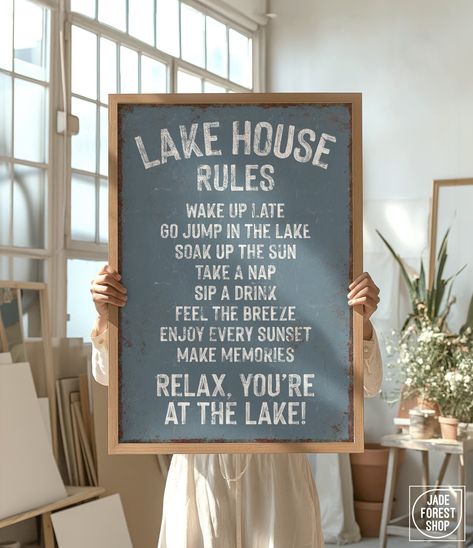 This retro-inspired "Lake House Rules" sign is a unique addition to your lake house wall decor. The vintage lettering and distressed texture add effortless, relaxed style to your modern farmhouse decor. Available printed on canvas, paper, or aluminum, framed or unframed, these make wonderfully thoughtful gifts!  SIZES  Choice of 8" x 12", 12" x 18", 20" x 30", 24" x 36", or 32" x 48"  MATERIALS  CANVAS -- Printed on smooth, clay-coated canvas, and gallery-wrapped over a 3/4" deep wood frame. Can Lake Theme Living Room, Fishing Lodge Decor Lake Cabins, Americana Lake House Decor, Lake House Artwork, Small Lake House Interior, Lakehouse Kitchen Ideas, Lake House Decor Living Room, Small Lake Cottage Interiors, Lake House Rules Sign