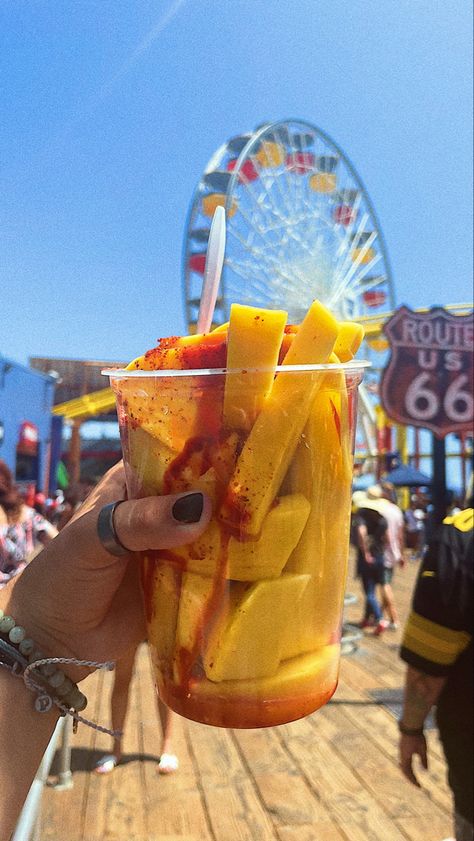 The most amazing, sweet, and fresh slices of mango covered in chamoy,lemon juice, and tajin on santa monica pier! Chamoy Snacks, Santa Monica Food, Dr Visuals, Mango Slices, Mexican Snacks, H2o Mermaids, Mexican Theme, Santa Monica Pier, Bts Chibi