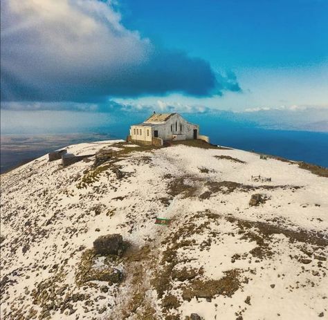 The chapel that sits on Croagh Patrick’s summit was built in 1905 by 12 local men, using local stone and cement that was hauled up the mountain’s steep sides by donkey. Croagh Patrick, Mountain S, Gcse Art, Emerald Isle, The Mountain, Monument Valley, Cement, Art Inspo, Built In