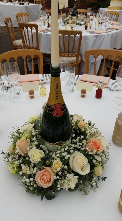 Champagne bottle with ring of flowers Champagne Bottle Centerpiece, Bottle Centerpiece Ideas, Brunch Centerpieces, Brunch Flowers, Champagne Centerpiece, Baby Shower Brunch Food, Diy Brunch, Brunch Table Setting, Sweet Brunch